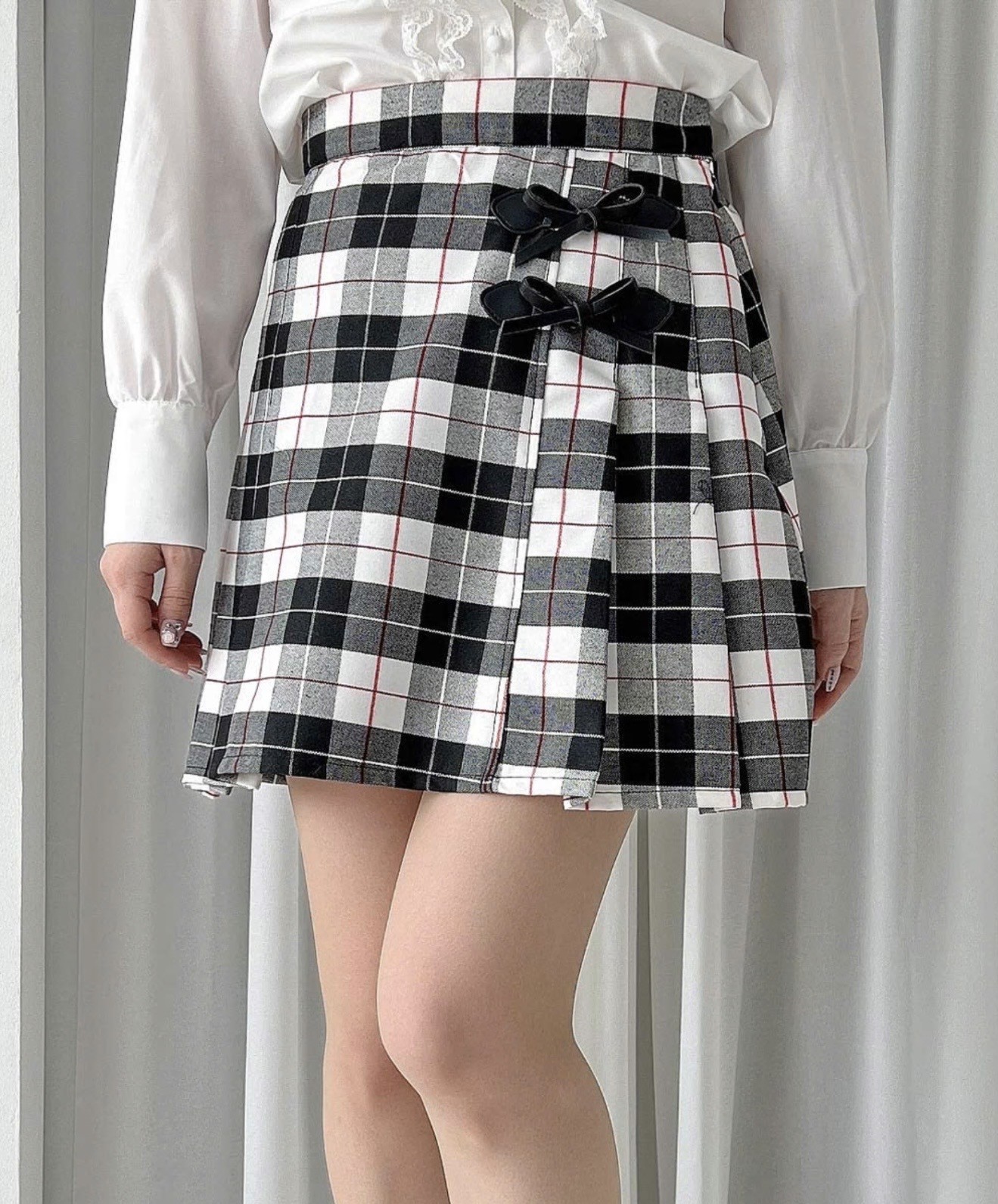 リボン使いとレトロなチェック柄が目を惹くミニスカート🎀